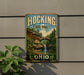 A vintage-style metal sign for Hocking State Forest in Ohio, featuring a scenic landscape with a waterfall and bridge.