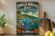 A vintage-style metal sign for Honolulu-Mokulele Bay, featuring a tropical beach scene with a sea turtle, palm trees, and colorful fish.
