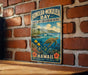 A vintage metal sign for Honolulu-Mokulele Bay, featuring a tropical beach scene with a sea turtle, coral, and fish.