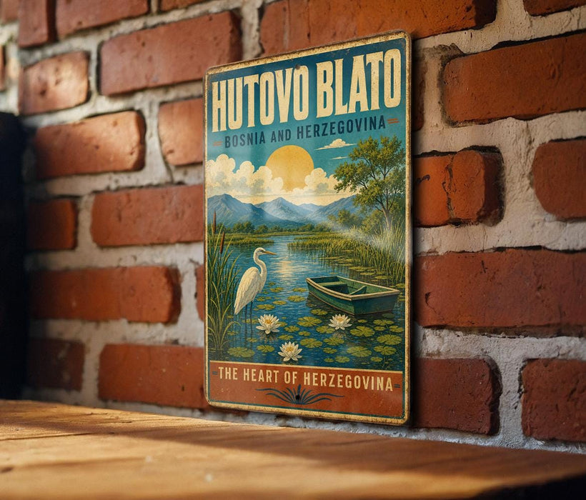 a vintage-style metal sign with a scenic illustration of a lake, a boat, and a bird, mounted on a brick wall.