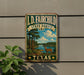 A vintage-style metal sign for the I.D. Fairchild State Forest in Texas, featuring a scenic landscape with a deer and a lake.
