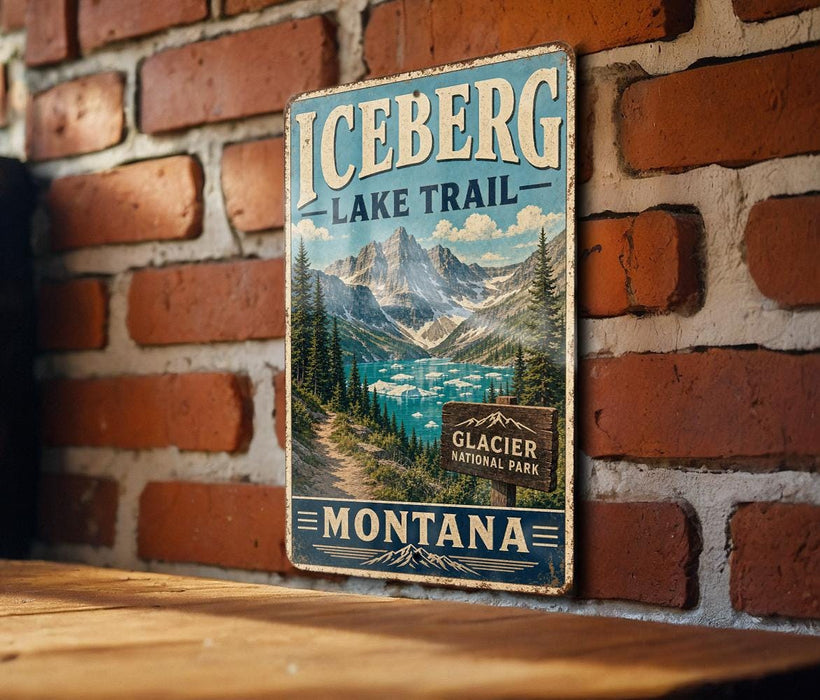 A vintage metal sign for the Glacier National Park in Montana, featuring a scenic mountain landscape with a lake in the background.