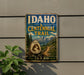 A vintage-style sign for the Idaho Centennial Trail, featuring a mountain landscape and the text "Idaho Centennial Trail" prominently displayed.