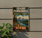 A vintage-style metal sign for Idaho Panhandle National Forests, featuring a scenic mountain landscape with pine trees and a river.