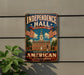 A vintage-style metal sign with the text "Independence Hall Philadelphia Pennsylvania" and an illustration of a building with a clock tower, surrounded by American flags.