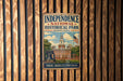 a vintage-style metal sign for Independence National Historical Park in Pennsylvania, with an illustration of the Pennsylvania State Capitol building and a bell tower.