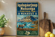 A vintage-style sign for Iqalugaarijup Nunanga, a territorial park in Nunavut, Canada, featuring a reindeer and a mountainous landscape.