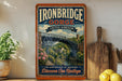 a vintage-style sign for Ironbridge Gorge, United Kingdom, with a bridge and greenery in the background.