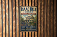 A vintage-style sign for Isaac Bell House in Newport, Rhode Island, featuring an illustration of the house and the text "Step Back in Time Experience History Architecture Newport".