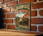 A vintage-style metal sign for the Jacksonville Historic District in Oregon, featuring an illustration of a historic building and the text "Step back in time".