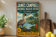 A vintage-style poster advertising the James Campbell National Wildlife Refuge in Hawaii, featuring a colorful illustration of a Hawaiian bird and tropical landscape.