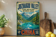 A vintage-style poster advertising the Juzhaigou Valley in China, featuring a scenic mountain landscape with a lake and waterfall.