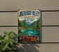 A vintage-style sign for the Juzhaigou Valley in China, featuring a scenic landscape with mountains, a lake, and a waterfall.