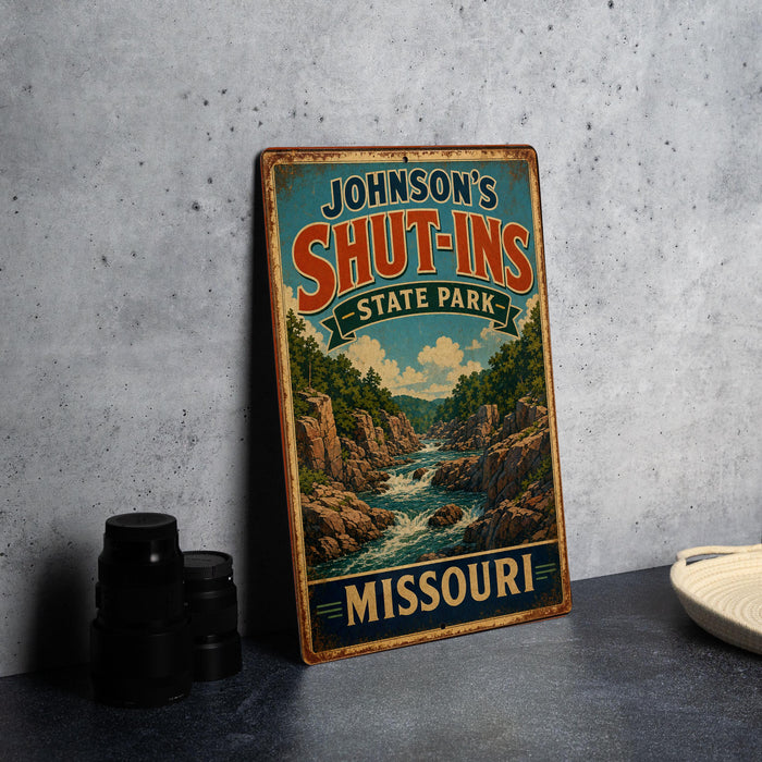 A vintage-style sign for Johnson's Shut-Ins State Park in Missouri, featuring a scenic illustration of a river and mountains.