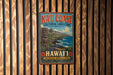 A vintage-style metal sign with the text "Kau Coast Cultural Landscape" and "Hawaii" is displayed on a wooden wall.