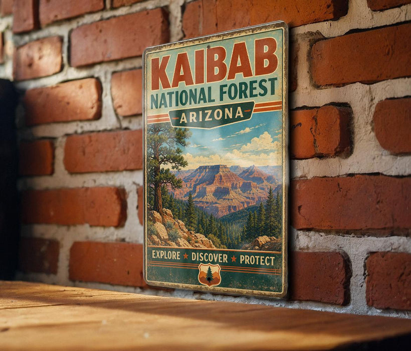 A vintage-style metal sign for Kaibab National Forest in Arizona, featuring a scenic mountain landscape and the words "Explore, Discover, Protect" in bold letters.