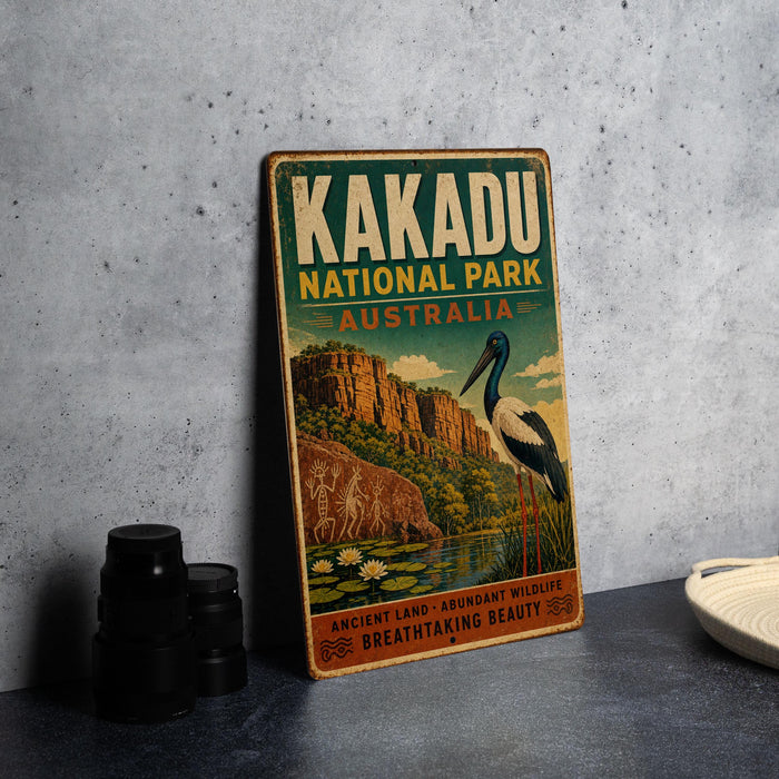 A vintage-style poster for Kakadu National Park, Australia, featuring a scenic illustration of the park's landscape and wildlife.