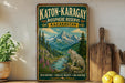 A vintage-style metal sign for the Katon-Karagay Biosphere Reserve in Kazakhstan, featuring a leopard and a mountain landscape.