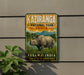 a sign for Kaziranga National Park, India, depicting a rhinoceros in a grassy field with mountains in the background.