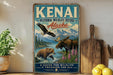 A vintage-style sign for the Kenai National Wildlife Refuge in Alaska, featuring an illustration of a moose, bear, and eagle in a natural setting.