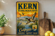 A vintage-style metal sign for Kern National Wildlife Refuge in California, featuring an illustration of ducks and other wildlife in a natural setting.