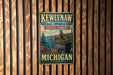 A vintage-style metal sign for Keweenaw National Historical Park, featuring a scenic landscape with a train and a river.