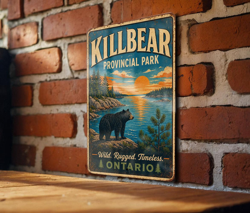 A vintage metal sign for Killbear Provincial Park, featuring a bear and a scenic landscape with a sunset.