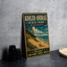 A vintage-style metal sign for Kohler-Andrae State Park in Wisconsin, featuring a scenic beach landscape with sand dunes and a lake.