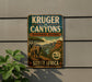 a vintage-style sign for Kruger to Canyons Biosphere Reserve in South Africa, depicting an elephant and a landscape with mountains and a river.