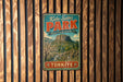 A vintage metal sign for Kula-Sahlili Park in Turkey, featuring a scenic landscape with mountains, trees, and a waterfall.