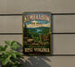 A vintage-style metal sign for Kumbrella State Forest in West Virginia, featuring a scenic landscape with mountains, trees, and a lake.