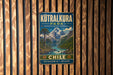 A vintage metal sign for the Kutralkura Park in Chile, featuring a scenic mountain landscape with a river and lush vegetation.
