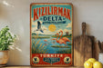 A vintage-style metal sign with a colorful illustration of flamingos, a bird, and a lake, along with text in Turkish. The sign is displayed on a shelf next to a wooden cutting board and some potted plants.