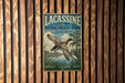 A vintage-style sign for the Lacasse National Wildlife Refuge in Louisiana, featuring a duck in flight and a lush, tropical landscape.