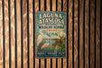 A vintage metal sign for Laguna Atascosa National Wildlife Refuge in Texas, featuring an illustration of various wildlife species.