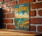 A vintage-style sign for Lake Bardawil in Egypt, featuring a seagull and a scenic landscape.