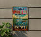 a vintage metal sign advertising Lake Burullus, a nature reserve in Egypt.
