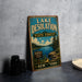 A vintage-style sign for Lake Desolation State Forest in New York, featuring a scenic landscape with a lake, pine trees, and mountains.