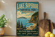 A vintage-style sign for Lake Superior Provincial Park in Ontario, featuring a scenic illustration of the lake surrounded by mountains and pine trees.