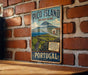 A vintage-style sign for Pico Island, Portugal, featuring a mountain landscape and vineyards.