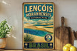 A vintage-style sign for Lencois Maranhenses National Park in Brazil, featuring a beach scene with palm trees and a blue sky.