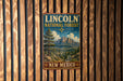 A vintage-style metal sign for the Lincoln National Forest in New Mexico, featuring a mountain landscape and pine trees.