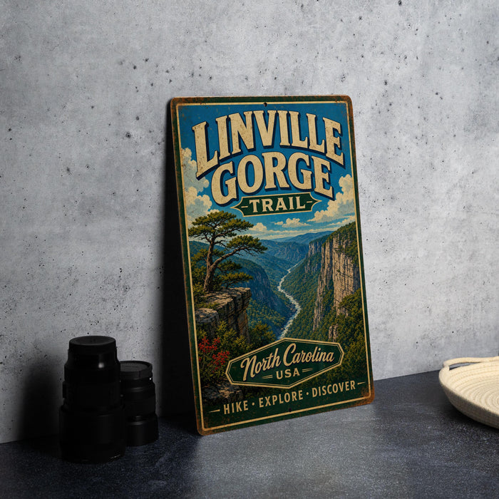 A vintage trail sign for Linville Gorge Trail in North Carolina, USA, featuring a scenic mountain landscape with a winding river.