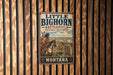 A vintage metal sign for Little Bighorn Battlefield National Monument in Montana, featuring an illustration of a Native American man on horseback.