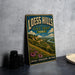 A vintage-style sign for Loess Hills State Forest, Iowa, featuring a scenic landscape with mountains, grass, and flowers.