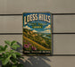 A vintage-style metal sign for Loess Hills State Forest in Iowa, featuring a scenic landscape with mountains, a river, and wildflowers.