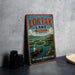 A vintage-style sign for "Loktak Lake" in India, featuring a boat on the lake and a person in traditional clothing.