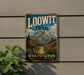 A vintage metal sign for the Loowit Trail in Washington, featuring a mountain landscape and a trail sign.