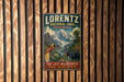 A vintage-style metal sign for Lorenz National Park in Indonesia, featuring a mountain landscape with a bird and a large animal, is displayed on a wooden wall.