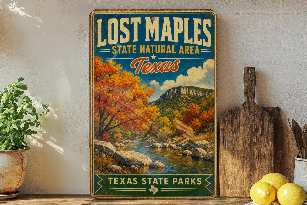 A vintage-style sign for Lost Maple State Natural Area in Texas, featuring a scenic landscape with a river, mountains, and autumn foliage.